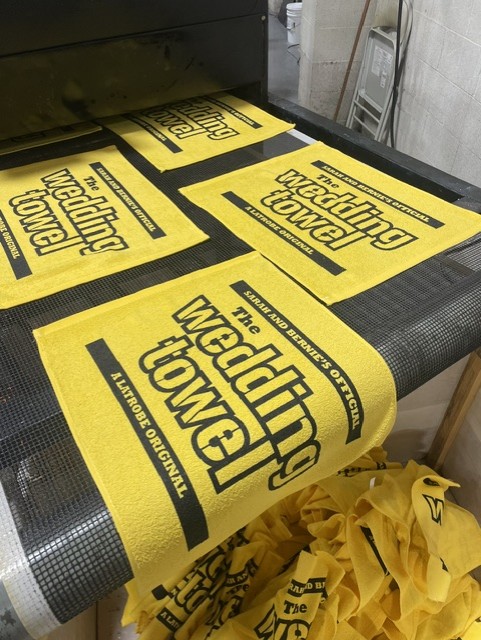 Custom wedding towels being printed on press at Rally Towels